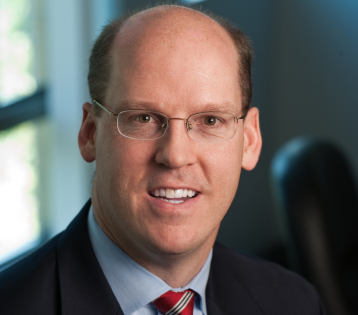 Edward P. Hackett, CRM, CPRM, CIC, CISR, headshot of a professional man in a suit.